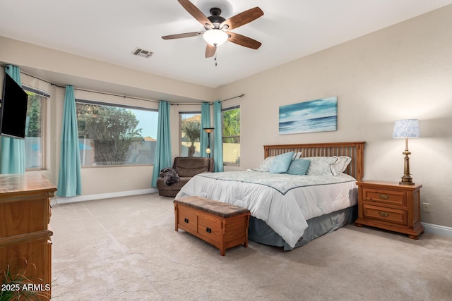 bedroom featuring baseboards, a ceiling fan, carpet flooring, and visible vents