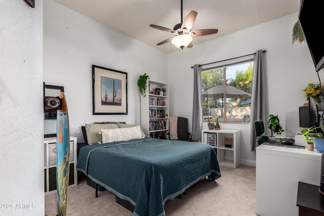 bedroom featuring ceiling fan and light carpet