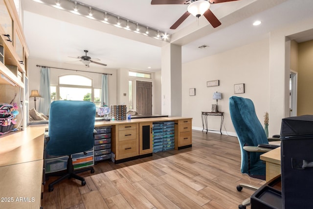 office area featuring ceiling fan, light wood-type flooring, and visible vents