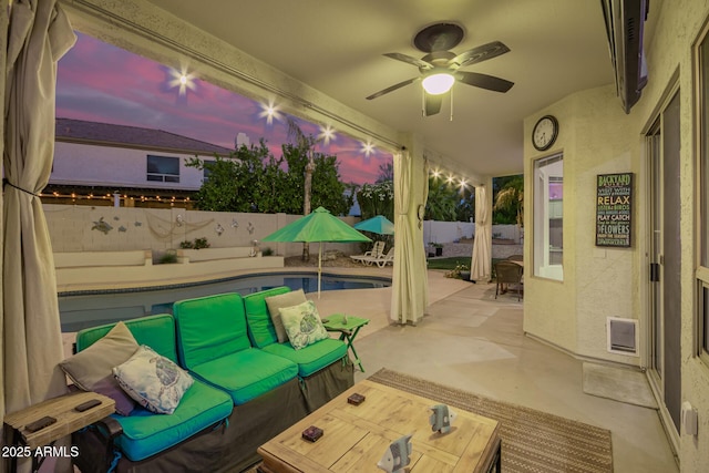 view of patio / terrace with a fenced backyard, a ceiling fan, and an outdoor hangout area