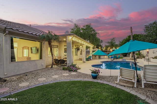 outdoor pool featuring a patio