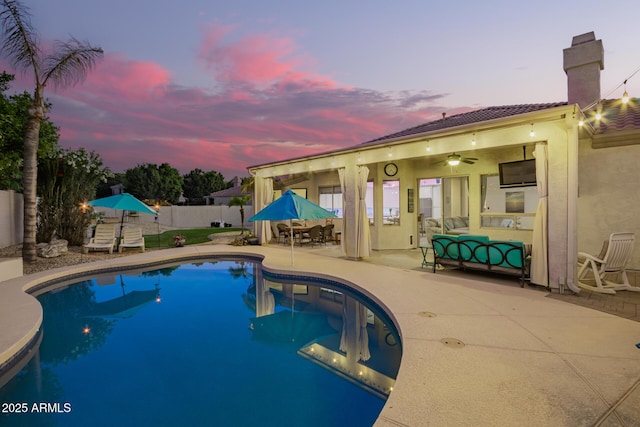view of swimming pool featuring a fenced backyard, a fenced in pool, a patio area, and outdoor dining space