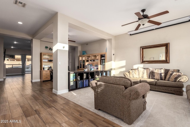 living area featuring ceiling fan, visible vents, wood finished floors, baseboards, and recessed lighting