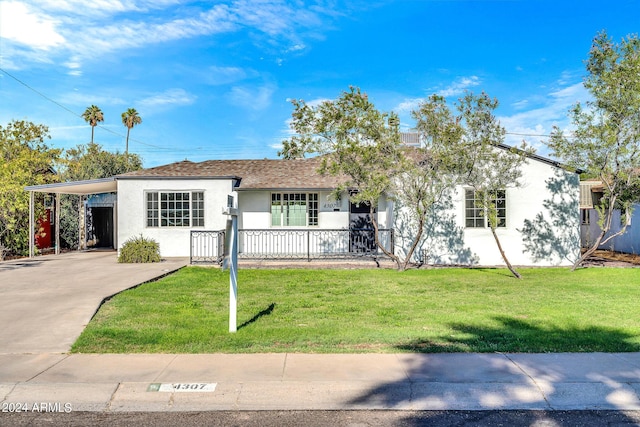 ranch-style home with a front lawn and a carport