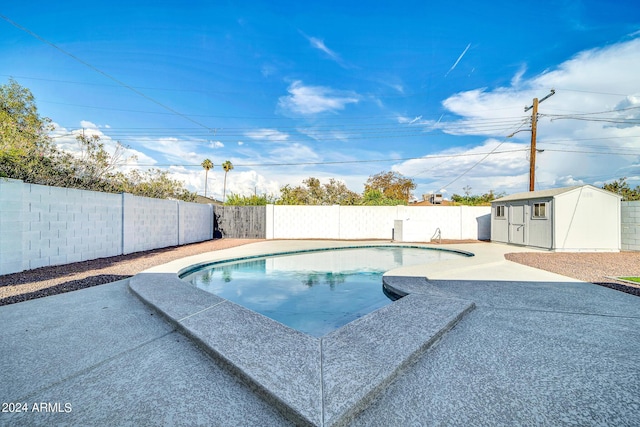 view of pool with a storage unit