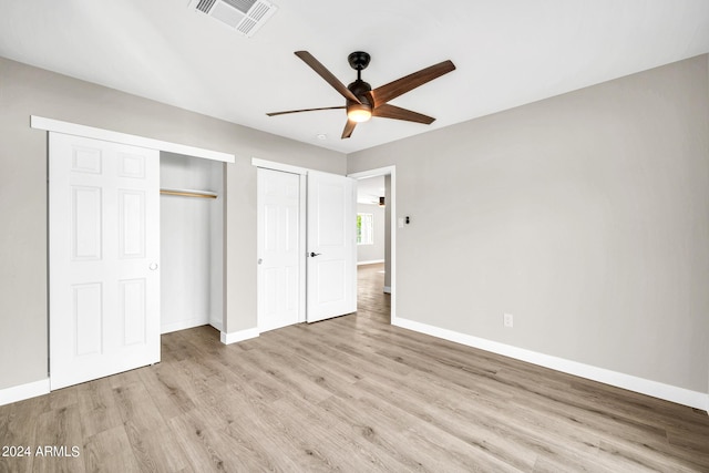 unfurnished bedroom with ceiling fan and light hardwood / wood-style flooring