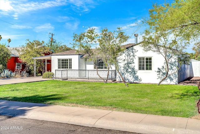 ranch-style house with a front lawn