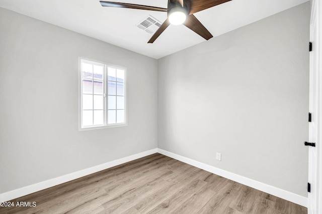 empty room featuring ceiling fan and light hardwood / wood-style floors