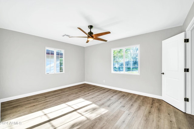 spare room with ceiling fan and light hardwood / wood-style floors