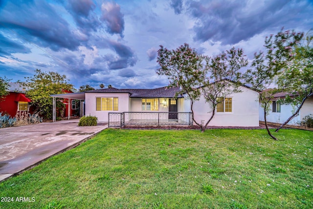 view of front of house featuring a front yard and a carport