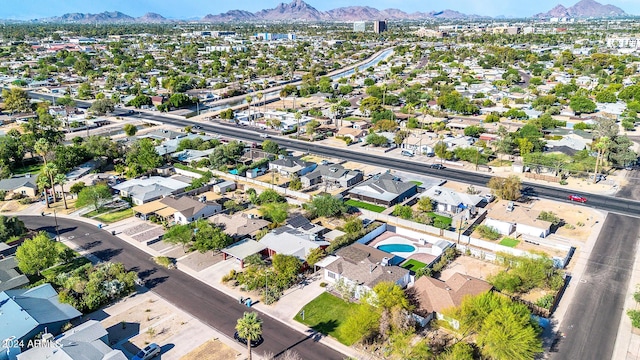 birds eye view of property featuring a mountain view