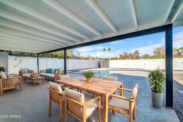 view of patio featuring an outdoor living space and a fenced in pool