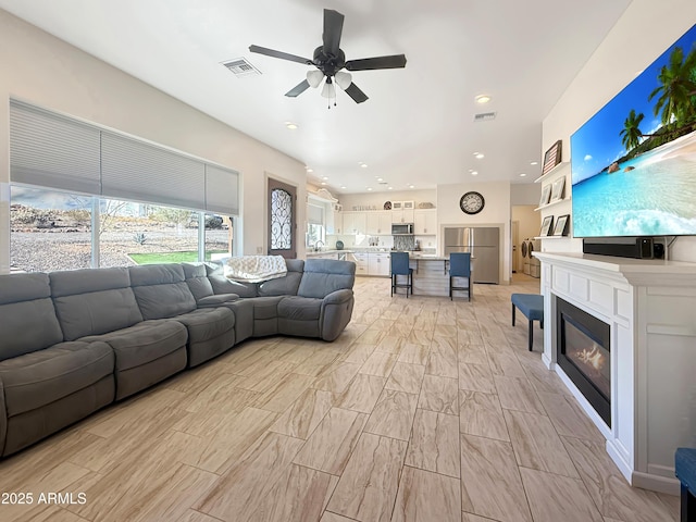 living room featuring ceiling fan