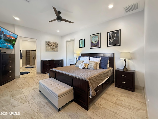 bedroom featuring connected bathroom and ceiling fan