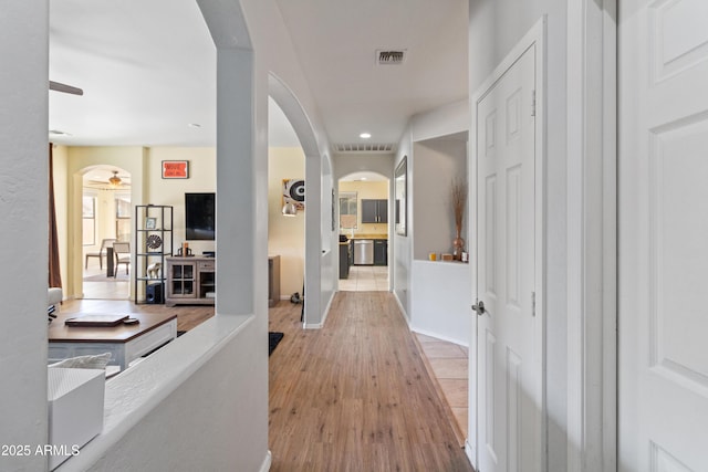 corridor featuring light hardwood / wood-style floors