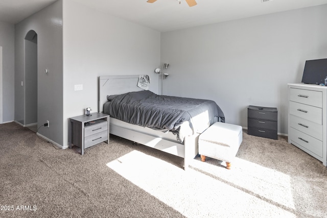 bedroom featuring ceiling fan and light carpet