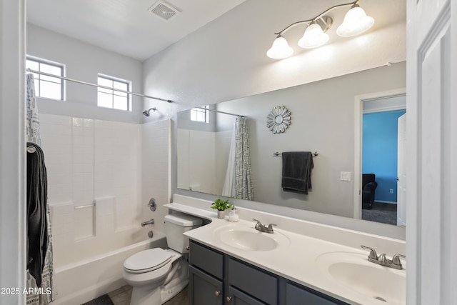 full bathroom with toilet, shower / tub combo with curtain, and vanity