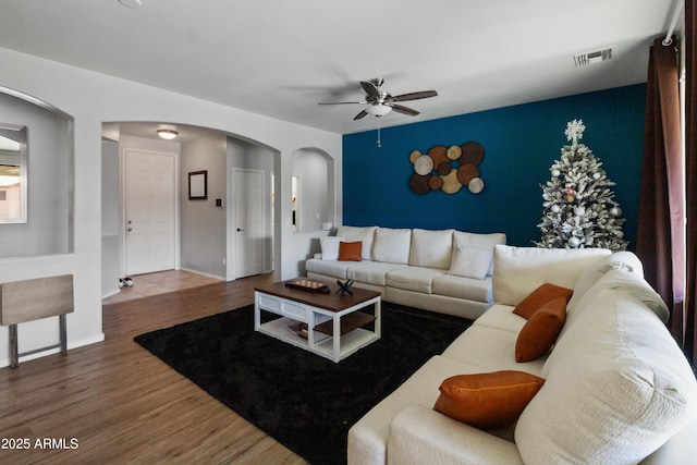 living room with hardwood / wood-style flooring and ceiling fan