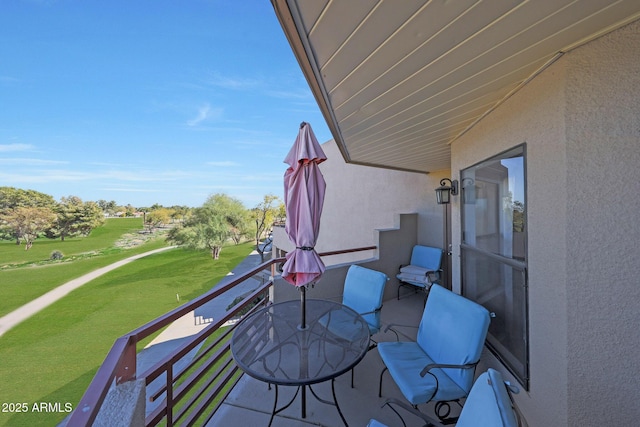 balcony featuring golf course view