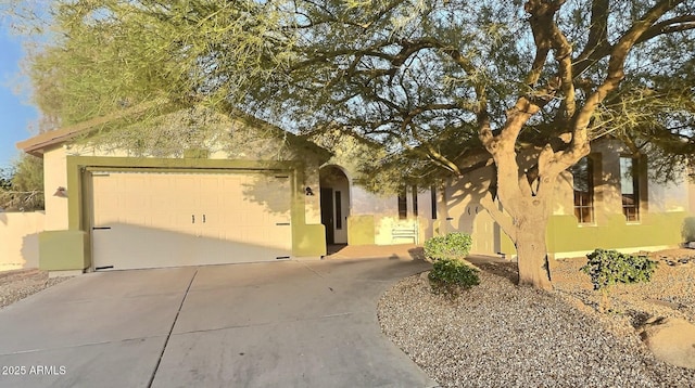 7313 S 25th Dr S, Phoenix, AZ 85041 - view of front of property featuring driveway, an attached garage, and stucco siding