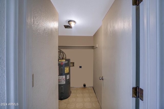 interior space featuring electric water heater and hookup for an electric dryer