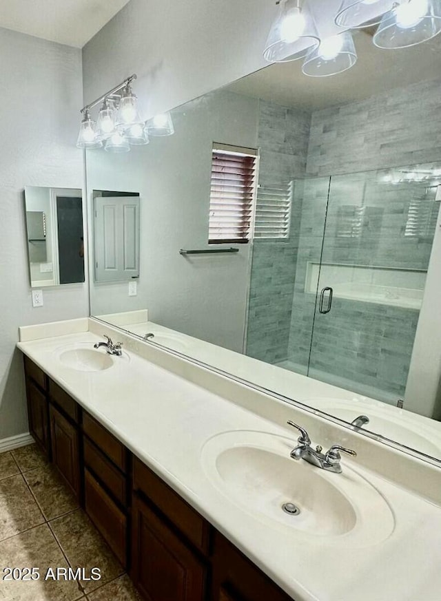 702 E Capricorn Way, Chandler, AZ 85249 - full bath with tile patterned flooring, double vanity, a shower stall, and baseboards