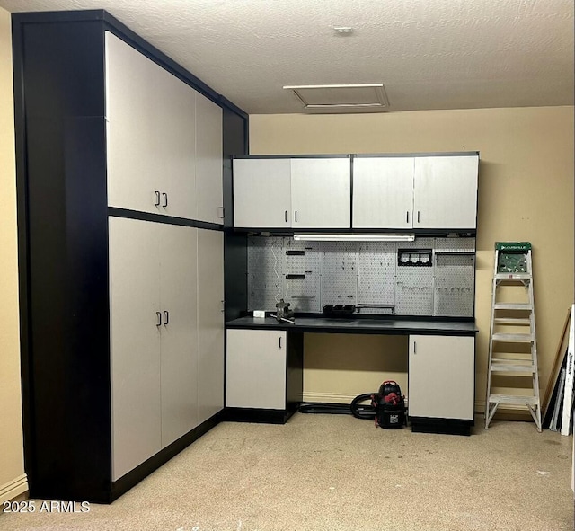 702 E Capricorn Way, Chandler, AZ 85249 - kitchen with white cabinetry, dark countertops, a textured ceiling, light colored carpet, and tasteful backsplash