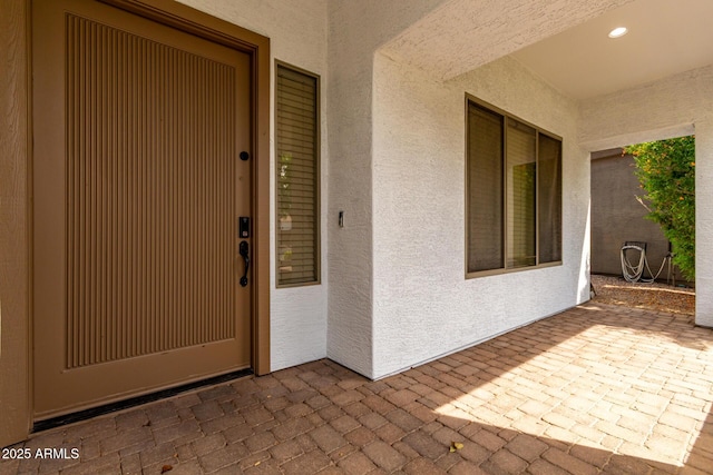702 E Capricorn Way, Chandler, AZ 85249 - property entrance with stucco siding and a patio area