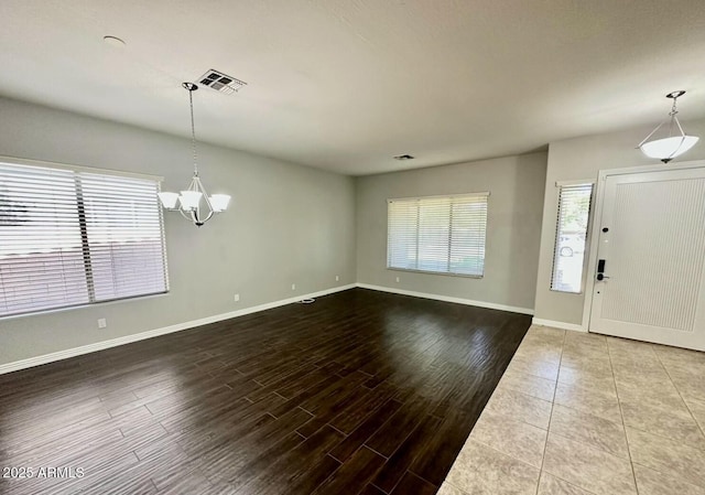 702 E Capricorn Way, Chandler, AZ 85249 - foyer entrance with a chandelier, baseboards, and wood finished floors