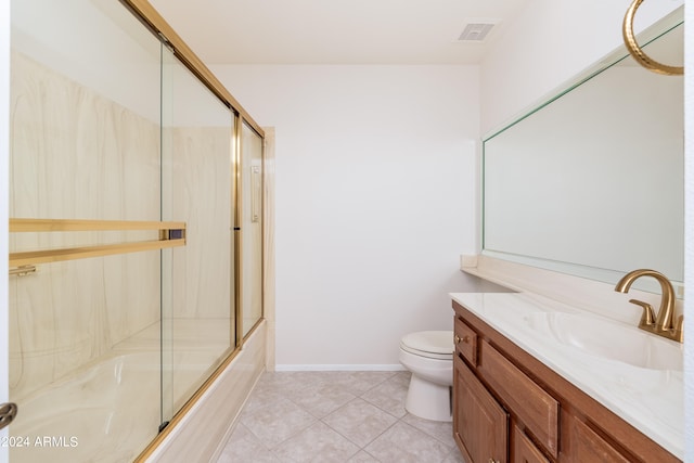 full bathroom with tile patterned floors, toilet, bath / shower combo with glass door, and vanity