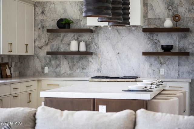 9611 E Clinton St, Scottsdale, AZ 85260 - kitchen with open shelves, light countertops, and backsplash