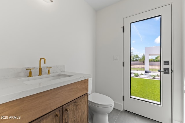 9611 E Clinton St, Scottsdale, AZ 85260 - bathroom with toilet, tile patterned floors, and vanity