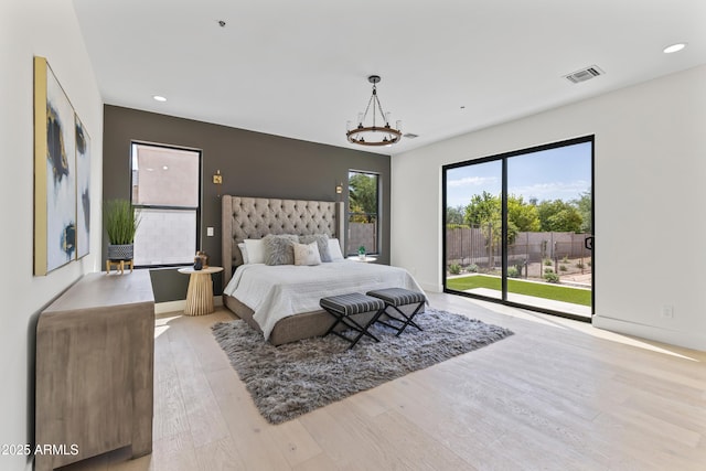 9611 E Clinton St, Scottsdale, AZ 85260 - bedroom featuring access to exterior, wood finished floors, recessed lighting, and baseboards