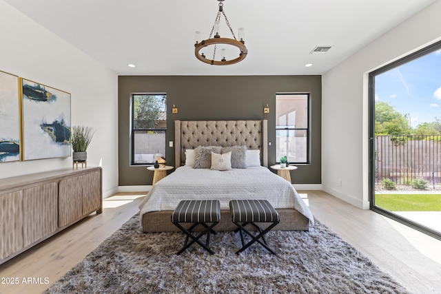 9611 E Clinton St, Scottsdale, AZ 85260 - bedroom featuring access to exterior, light wood-style flooring, baseboards, and recessed lighting