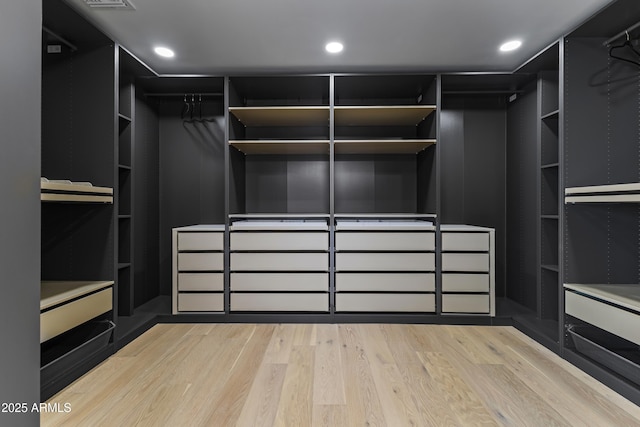 9611 E Clinton St, Scottsdale, AZ 85260 - walk in closet with light wood-style floors