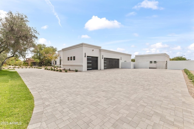 9611 E Clinton St, Scottsdale, AZ 85260 - garage featuring fence and decorative driveway