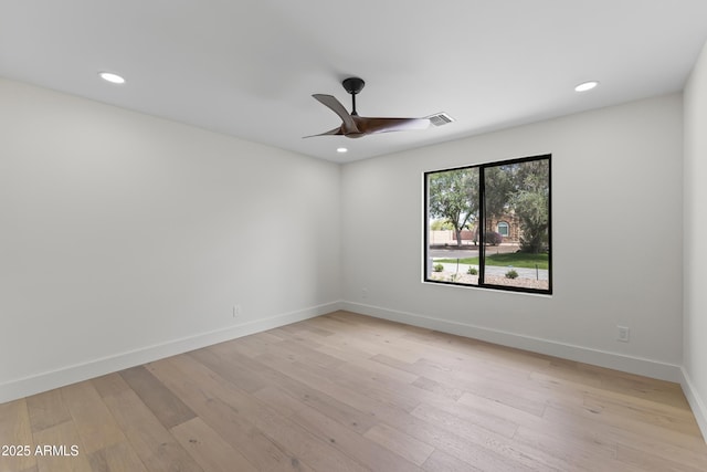 9611 E Clinton St, Scottsdale, AZ 85260 - spare room featuring a ceiling fan, light wood-style floors, recessed lighting, and baseboards