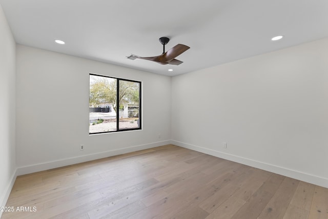 9611 E Clinton St, Scottsdale, AZ 85260 - spare room with ceiling fan, light wood finished floors, recessed lighting, and baseboards
