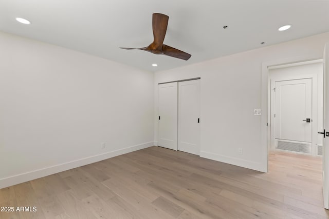 9611 E Clinton St, Scottsdale, AZ 85260 - unfurnished bedroom with light wood-style floors, recessed lighting, baseboards, and a closet