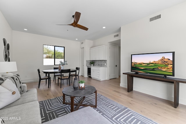9611 E Clinton St, Scottsdale, AZ 85260 - living area featuring light wood-style floors, ceiling fan, recessed lighting, baseboards, and beverage cooler