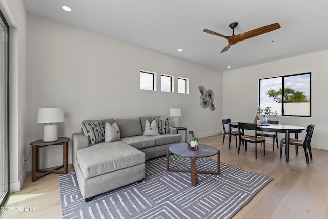 9611 E Clinton St, Scottsdale, AZ 85260 - living room featuring a ceiling fan, light wood finished floors, healthy amount of natural light, recessed lighting, and baseboards