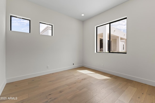 9611 E Clinton St, Scottsdale, AZ 85260 - empty room with light wood-style flooring, baseboards, and recessed lighting