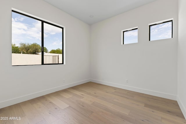 9611 E Clinton St, Scottsdale, AZ 85260 - empty room with baseboards and light wood-style floors