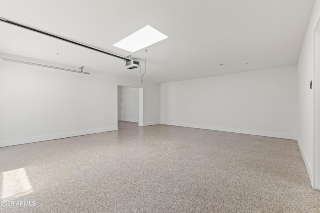 9611 E Clinton St, Scottsdale, AZ 85260 - garage with a garage door opener and baseboards
