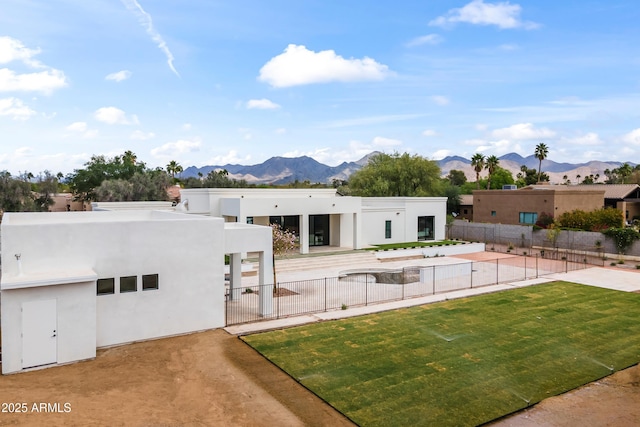 9611 E Clinton St, Scottsdale, AZ 85260 - view of front facade featuring a mountain view, fence, and stucco siding