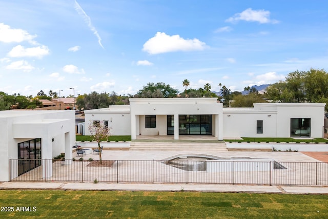 9611 E Clinton St, Scottsdale, AZ 85260 - rear view of property featuring stucco siding and fence