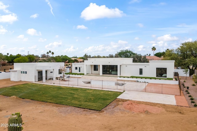 9611 E Clinton St, Scottsdale, AZ 85260 - rear view of house featuring stucco siding and a patio area