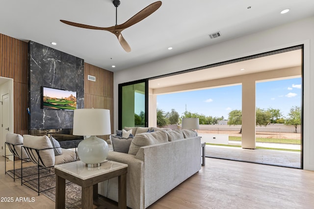 9611 E Clinton St, Scottsdale, AZ 85260 - living room with ceiling fan, wood finished floors, and recessed lighting