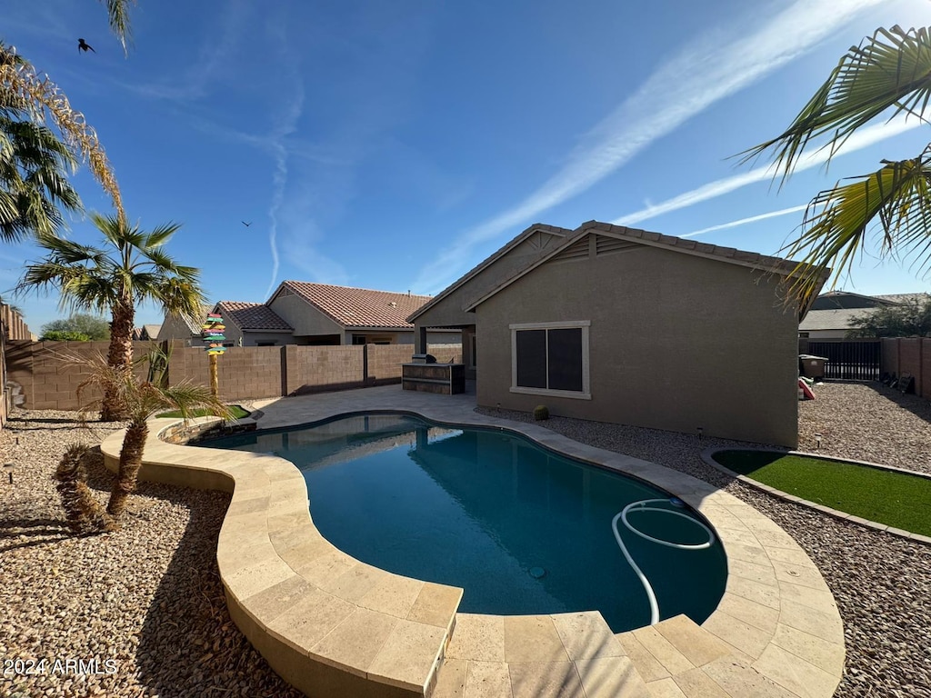 view of swimming pool with a patio