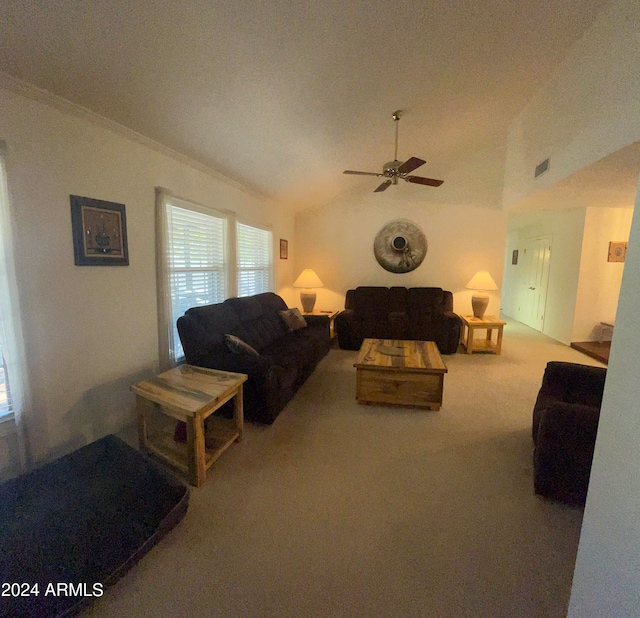 living room with lofted ceiling, carpet, and ceiling fan